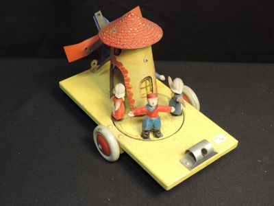 a small toy car with a windmill on top of it