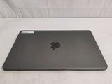 an apple laptop computer sitting on top of a white table