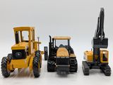 three toy vehicles that are sitting next to each other