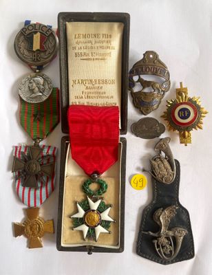 an assortment of medals and medals are displayed in a case