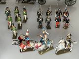 many figurines of soldiers on display on a table