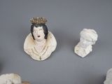 a lot of statues that are sitting on a table