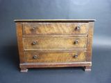 an old wooden chest of drawers on a black background