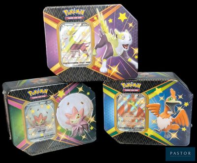 three different types of pokemon trading cards in a tin box