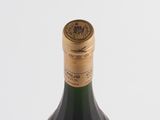 a bottle of wine that is sitting on a table