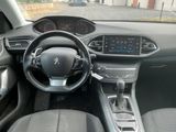 the interior of a car with a steering wheel and dashboard controls