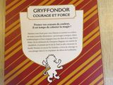 the back cover of a harry potter book on a wooden table