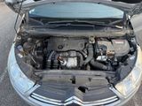 a car with its hood open and the engine in it