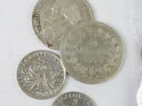 a lot of coins that are sitting on a table