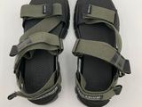 men ' s black and green sandals on a white background