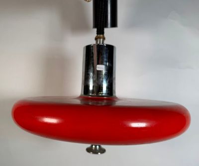 a red light that is hanging from the ceiling