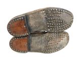 two pairs of shoes that are sitting on top of each other
