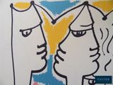 a drawing of two people facing each other on a wall
