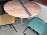 a table with two chairs and a table with a table top on it