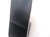 a cell phone that is sitting on top of a stand