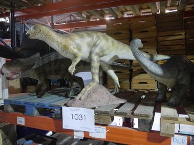 two dinosaurs that are on display in a store