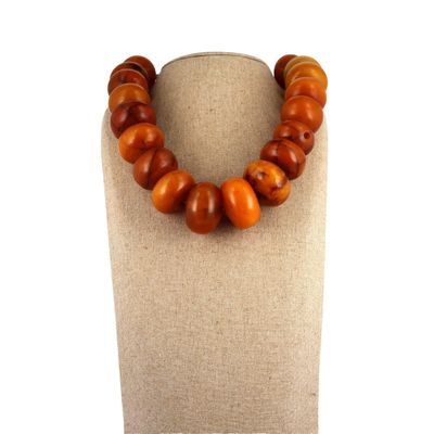 a close up of a necklace on a mannequin on a mannequin