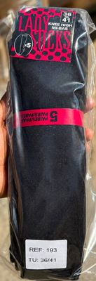 a person holding a bag of coffee in their hand