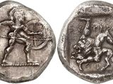 a silver coin with an image of a man on a horse