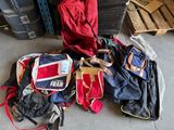 a pile of luggage sitting on the floor next to a pile of luggage
