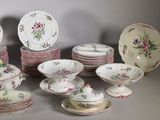 many plates and bowls that are sitting on a table