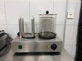 une photo d'une friteuse professionnelle équipée d'un panier sur le dessus