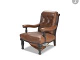 an image of a brown leather chair on a white background