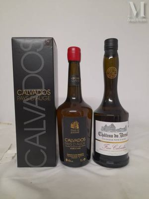 two bottles of cavados and a box of wine on a table