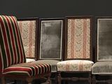 four chairs that are sitting next to each other