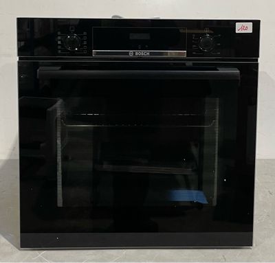an image of a black oven with the door open