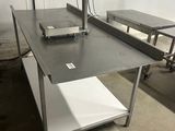 a table with a scale on top of it in a room
