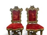 pair of antique chairs with red velvet upholstered seats