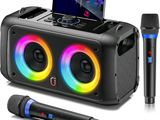 a close up of a speaker with two microphones and a cell phone