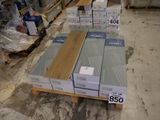 boxes of wood are stacked on a pallet in a warehouse