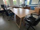 a room with a long table and chairs in it