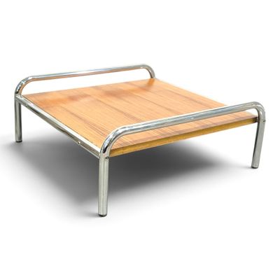 a metal bed frame with a wooden top on a white background