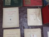 several books are lined up on a table in a room