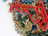 a pile of assorted beads and chains on a table