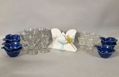 a group of glassware and a figurine on a table