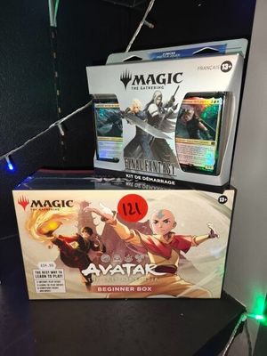 two boxes of magic the gathering items on a table