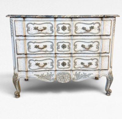 an image of a chest of drawers with ornate designs
