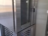 a large stainless steel refrigerator in the corner of a room