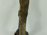 a person holding a knife in their hand and a knife in the other hand