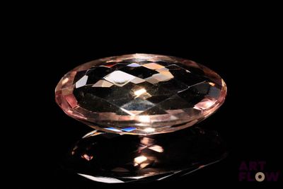 an image of a pink diamond on a black surface