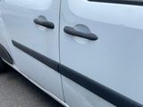 a white van that is parked on the side of the road