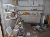 an image of a kitchen with a lot of clutter on the floor
