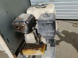 a machine that is sitting on the ground next to a building