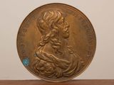 l'image d'une pièce d'or sur laquelle figure le visage d'une femme