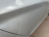 a close up of a car door handle with a sticker on it