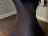 a black table with two cups on top of it